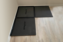 Load image into Gallery viewer, Drop-n-flop floor protector can be reconfigured to fit in corners.