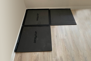 Drop-n-flop floor protector can be reconfigured to fit in corners.